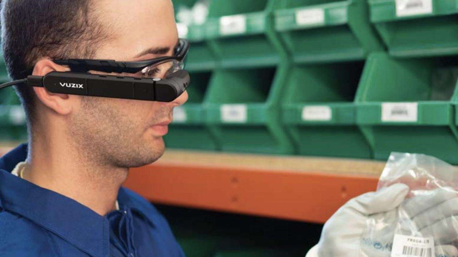 Picture of a man wearing Vuzix smartglasses.