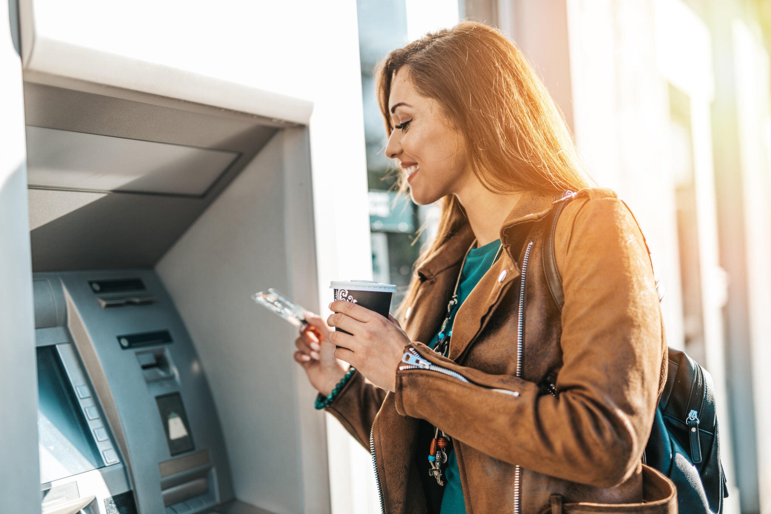 women at an ATM in bank